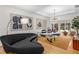 Spacious living room with a tray ceiling, stylish furniture, and sliding glass doors to the backyard at 2861 Dorby Close Ne, Brookhaven, GA 30319