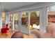 Bright sunroom featuring large sliding glass doors that lead to a wooden deck and outdoor seating at 2861 Dorby Close Ne, Brookhaven, GA 30319