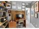 Well lit office space with built in shelving, wooden desk, and modern decor at 2861 Dorby Close Ne, Brookhaven, GA 30319