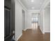 Inviting foyer with hardwood floors and a view of the living area's natural light at 404 Village Ln, Fairburn, GA 30213
