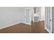 Versatile room featuring hardwood floors and glass French doors at 404 Village Ln, Fairburn, GA 30213