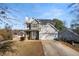 Charming two-story home featuring stone accents, a cozy front porch, and an attached two-car garage at 832 Summit Park Trl, Mcdonough, GA 30253