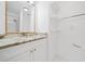 Bathroom featuring granite countertops, a mirror, and custom shelving at 1659 Executive Park Ne Ln, Brookhaven, GA 30329