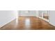 Empty bedroom boasting newly refinished hardwood floors, neutral walls, and modern trim at 1659 Executive Park Ne Ln, Brookhaven, GA 30329