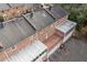 Aerial view of brick townhomes featuring private patios, balconies, and ample parking at 1659 Executive Park Ne Ln, Brookhaven, GA 30329