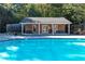 Beautiful in-ground pool with bath house and mature trees providing shade and privacy at 1659 Executive Park Ne Ln, Brookhaven, GA 30329