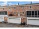 Rear exterior view showcasing the brick facade and the backyard at 1659 Executive Park Ne Ln, Brookhaven, GA 30329