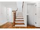 Elegant staircase with wood treads, white risers, and a detailed wood banister at 1659 Executive Park Ne Ln, Brookhaven, GA 30329