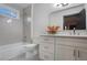 This bright bathroom includes a large window, modern tiling, and a sleek vanity at 190 Adair Se Ave, Atlanta, GA 30315