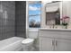 This bathroom features a tub, large window, modern tiling, and a sleek vanity at 190 Adair Se Ave, Atlanta, GA 30315