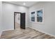 Cozy bedroom with wood-look flooring, ample natural light, and a modern interior door at 190 Adair Se Ave, Atlanta, GA 30315