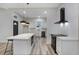 Updated kitchen featuring a central island, modern appliances, white cabinets, and sleek countertops at 190 Adair Se Ave, Atlanta, GA 30315