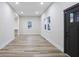 Bright living room with wood-look flooring, recessed lighting, and access to the front door at 190 Adair Se Ave, Atlanta, GA 30315