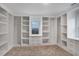 This walk-in closet features ample shelving, storage drawers, recessed lighting, and window at 190 Adair Se Ave, Atlanta, GA 30315