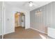 Cozy bedroom featuring a sunroom, modern lighting, and patterned walls at 215 Piedmont Ne Ave # 204, Atlanta, GA 30308