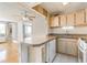 Kitchen with breakfast bar and tiled backsplash in unit 204, and stainless steel sink at 215 Piedmont Ne Ave # 204, Atlanta, GA 30308