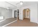 Cozy living room with mirrored wall, ceiling fan, and doorways that lead to other areas of the home at 215 Piedmont Ne Ave # 204, Atlanta, GA 30308