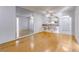 Open-concept layout with hardwood floors, mirrored wall and a view of the kitchen at 215 Piedmont Ne Ave # 204, Atlanta, GA 30308