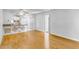 Bright living room with hardwood floors leading to an open kitchen design at 215 Piedmont Ne Ave # 204, Atlanta, GA 30308