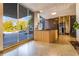 Lobby of building featuring front desk with wood paneling, views of the exterior and dark marble accent wall at 215 Piedmont Ne Ave # 204, Atlanta, GA 30308