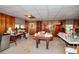 This is an unfinished basement with tile ceiling, wood paneling, and a large storage area at 2798 Tralyn Ct, Decatur, GA 30034