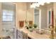 Traditional bathroom with a white vanity, mirror, and a view into the shower and toilet at 2798 Tralyn Ct, Decatur, GA 30034