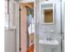 Bright bathroom with a pedestal sink, tiled walls, and a window with natural light at 2798 Tralyn Ct, Decatur, GA 30034