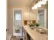 Bathroom featuring tiled walls, dual sink vanity and shower at 2798 Tralyn Ct, Decatur, GA 30034