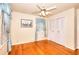 Bedroom featuring hardwood floors, a ceiling fan, and a double door closet at 2798 Tralyn Ct, Decatur, GA 30034