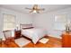 Bedroom featuring hardwood floors, ceiling fan and windows at 2798 Tralyn Ct, Decatur, GA 30034