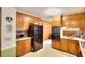 Well-lit kitchen with classic wood cabinetry, modern appliances, and efficient layout at 2798 Tralyn Ct, Decatur, GA 30034