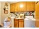 Functional laundry room with ample cabinet space and modern washer and dryer at 2798 Tralyn Ct, Decatur, GA 30034