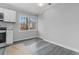 Bright dining area features a window with natural light, gray walls and gray wood-style floors at 2825 Middleburg Dr, Atlanta, GA 30349