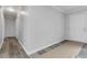 Hallway with a view to the front door and new gray-toned flooring at 2825 Middleburg Dr, Atlanta, GA 30349