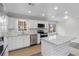 Bright kitchen featuring white cabinets, stainless steel appliances, granite countertops, and a stylish island at 2825 Middleburg Dr, Atlanta, GA 30349