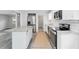 Newly renovated kitchen featuring stainless steel appliances, white cabinets, granite counters and a peninsula island at 2825 Middleburg Dr, Atlanta, GA 30349