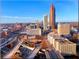 Daytime aerial view of the Atlanta cityscape with its iconic buildings and highway at 400 W Peachtree Nw St # 3216, Atlanta, GA 30308