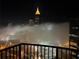 Partial view of downtown Atlanta skyline from balcony in heavy fog at night at 400 W Peachtree Nw St # 3216, Atlanta, GA 30308