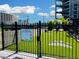 Fully-fenced dog park with artificial turf, seating, and play area for residents' pets at 400 W Peachtree Nw St # 3216, Atlanta, GA 30308