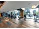 Well-equipped fitness center with treadmills, ellipticals, and stationary bikes overlooking outdoor lounge at 400 W Peachtree Nw St # 3216, Atlanta, GA 30308