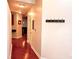 Hallway with hardwood floors, coat rack and access to other rooms at 400 W Peachtree Nw St # 3216, Atlanta, GA 30308