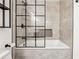 Bathroom with tiled tub-shower, and a shower-glass frame in a grid pattern at 434 Mcgill Ne Pl, Atlanta, GA 30312