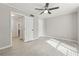 Bedroom with tiled floor, neutral colors, and access to a bathroom and closet at 434 Mcgill Ne Pl, Atlanta, GA 30312