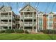 Exterior of condominium showing three stories, multiple balconies and green lawn at 434 Mcgill Ne Pl, Atlanta, GA 30312