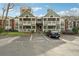 Exterior of condominiums with balconies and designated guest parking in front at 434 Mcgill Ne Pl, Atlanta, GA 30312