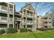 Exterior of condominium showing three stories, multiple balconies and green lawn at 434 Mcgill Ne Pl, Atlanta, GA 30312