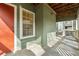 Inviting front porch with wood ceiling, window and orange front door at 434 Mcgill Ne Pl, Atlanta, GA 30312