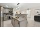 Modern kitchen featuring stainless steel appliances and a breakfast bar for casual dining at 434 Mcgill Ne Pl, Atlanta, GA 30312