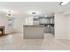 Bright living room and kitchen featuring a breakfast bar and tile floors at 434 Mcgill Ne Pl, Atlanta, GA 30312