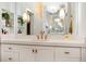 Bright bathroom featuring a white vanity, quartz countertop and gold hardware at 170 Boulevard Se # 412E, Atlanta, GA 30312